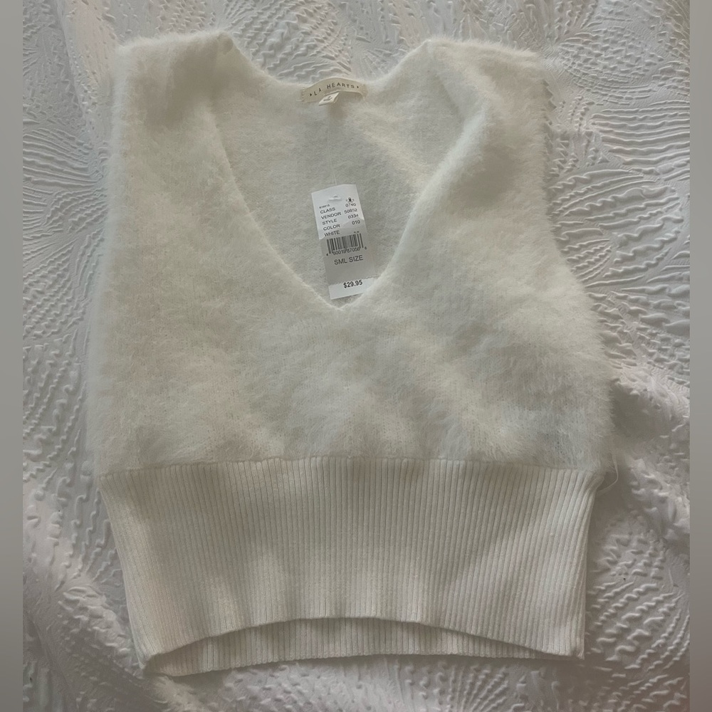 Fluffy white vest